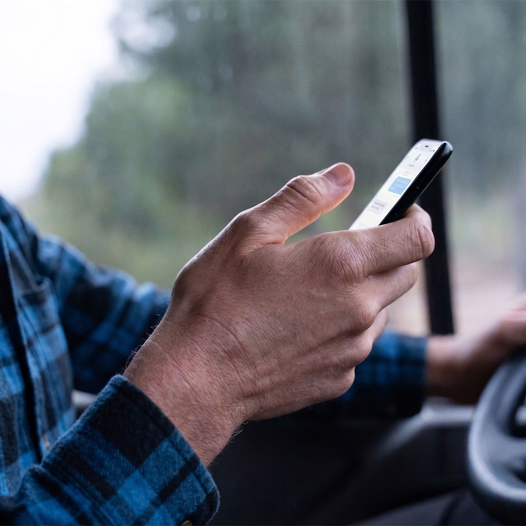 Close-up of a hand checking a smartphone, representing a customer reached by a digital marketing agency.