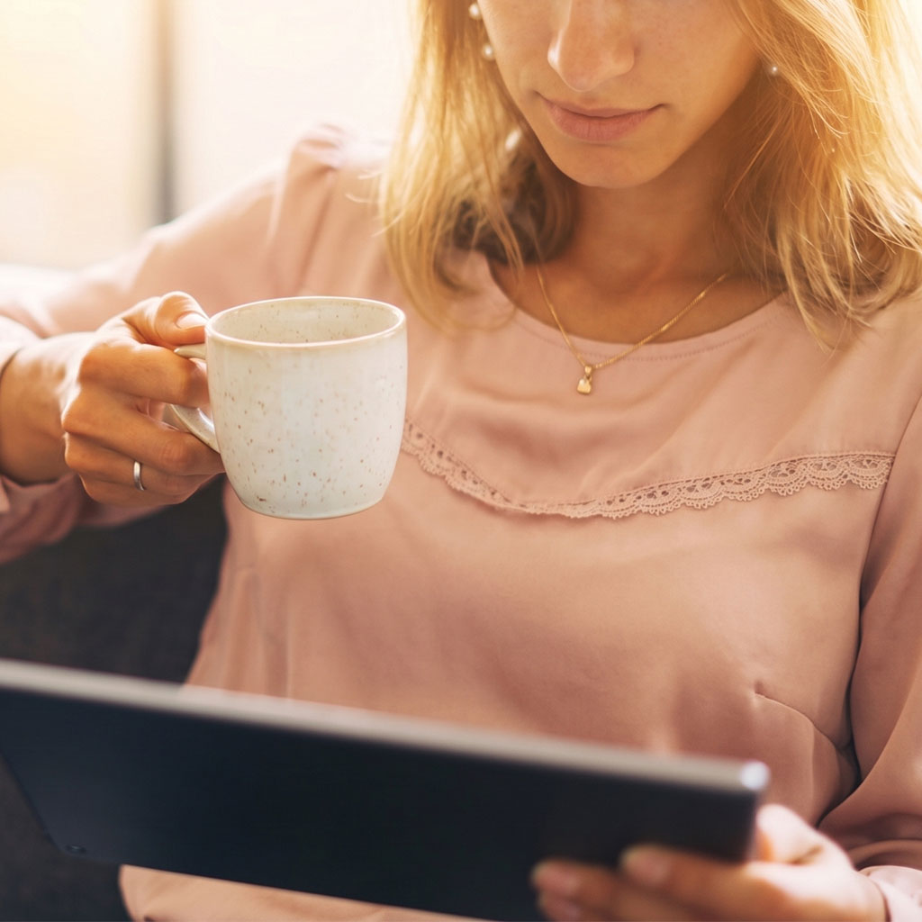 Close-up of a person browsing a website on their laptop, representing a visitor engaging with a site built by our web design company.